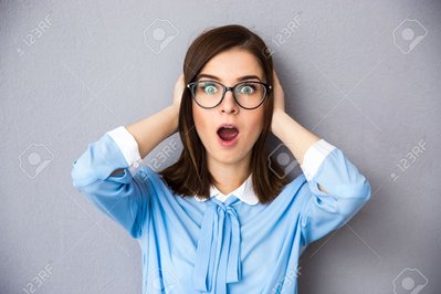 38374403-surprised-businesswoman-over-gray-background-wearing-in-blue-shirt-and-glasses-covers-her-ears-with-.jpg